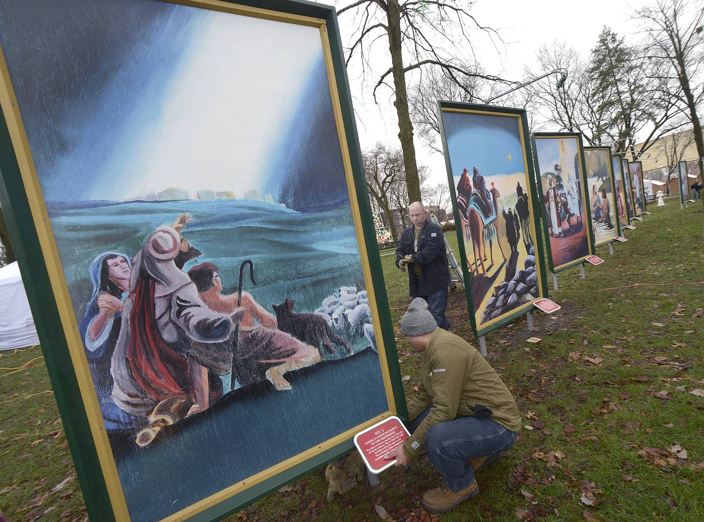 Many volunteers were on hand Saturday morning to help put up the 4-foot-7 paintings depicting the life of  Christ at Washington Square in Ottawa.