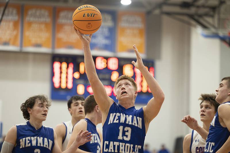 Newman’s George Jungerman pulls down a rebound against Eastland Tuesday, Dec. 10, 2024, at Eastland High School.
