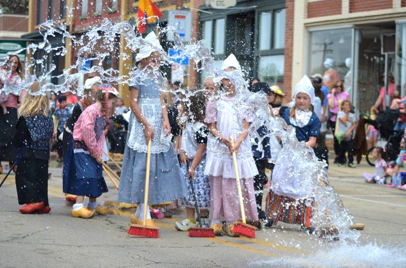 Dressed in authentic Dutch clothing, children had fun scrubbing the street at Fulton's Dutch Days on Saturday, May 6, 2023.