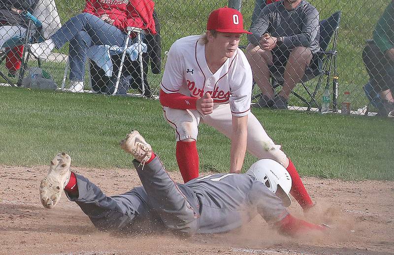 Ottawa pitcher George Shumway tags out L-P's Jackson Piecha stealing home on a wild pitch on Friday, May 2, 2025 at Ottawa High School.