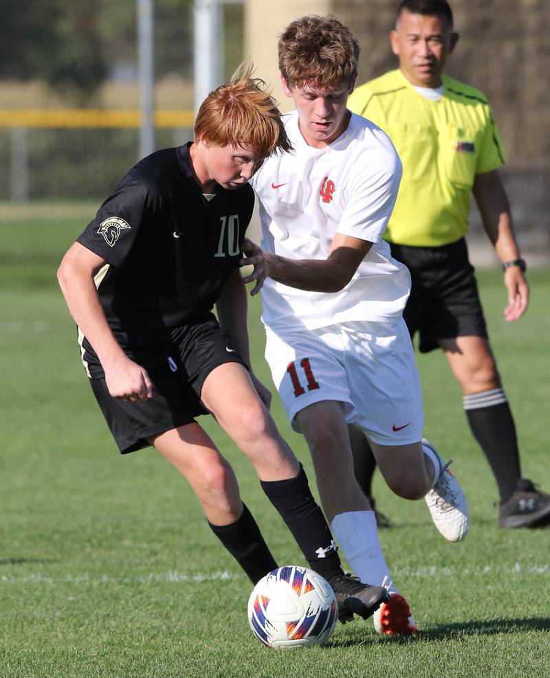 Sycamore's Jameson Carl controls the ball in front of La Salle-Peru's Jason Curran during their game Wednesday, Sept. 7, 2022, at Sycamore High School.