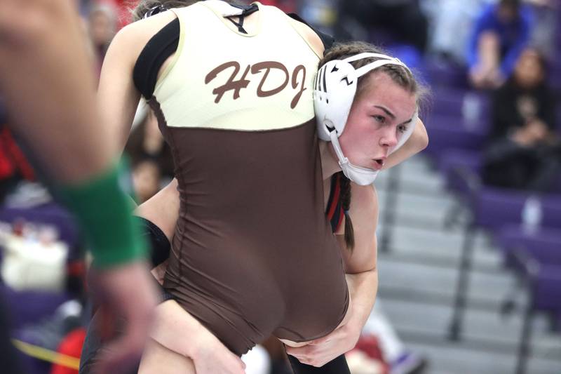 Huntley’s Aubrie Rohrbacher, right, prepares to throw Jacobs’ Aryanna Geiger at 130 pounds in varsity girls IHSA Regional Championship wrestling action on Saturday, February 7, 2026, at Hampshire High School in Hampshire.