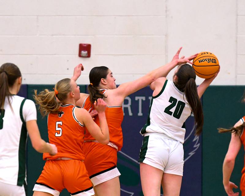 Glenbard West's Ellie Noble (20) goes up for a shot and gets fouled by St. Charles East's Caleigh Higgins (44) during the 4A Sectional championship game on Thursday Feb. 26, 2026, held at Bartlett High School.