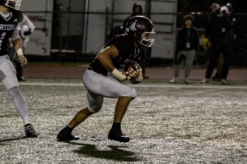 Lockport's Chris Miller looks for an opening during an 8A varsity football playoff game against Homewood-Flossmoor at Lockport Township High School East Campus on Nov. 8, 2025.
