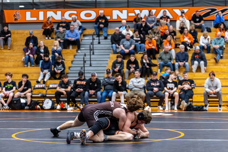 Lincoln-Way West’s Blake Cagwin and Joliet Catholic’s Vince Skedel compete in the 175 pound match at Lincoln-Way West on Jan. 8, 2026.