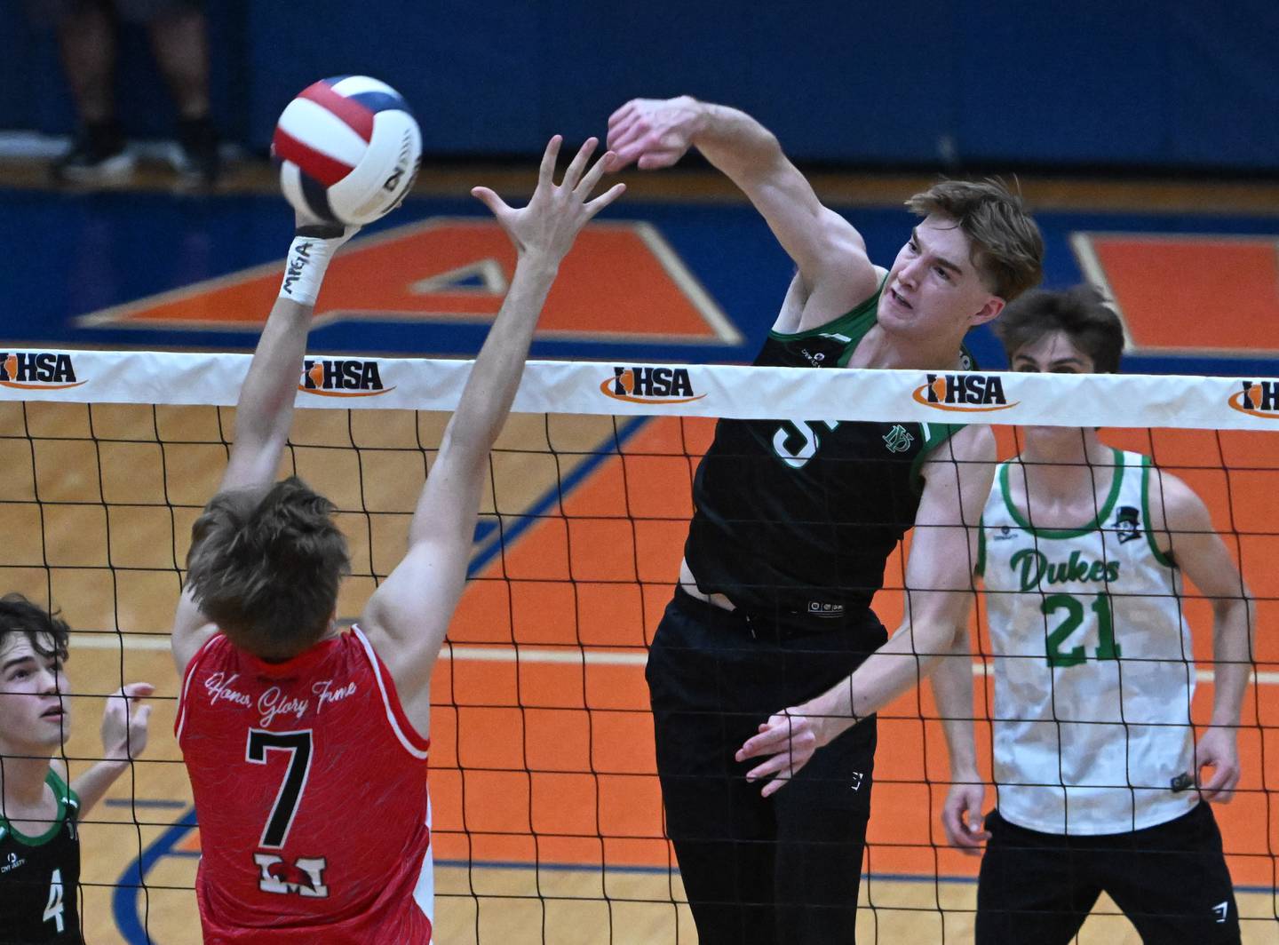 York's Logan Rice (5) hits past Marist's Jack Meador (7) during the IHSA state boys volleyball championship match on Saturday, June 1, 2024 in Hoffman Estates.