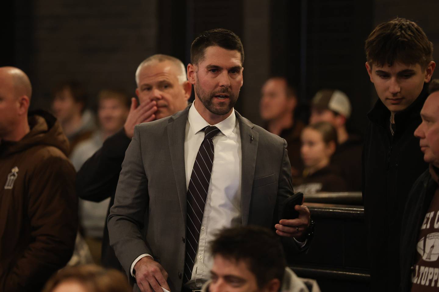 Ryan Quigley, director of institutional advancement, waits for the start of the Joliet city council meeting to vote on the Joliet Catholic Academy stadium plan on Tuesday, Jan 20, 2026 in Joliet.