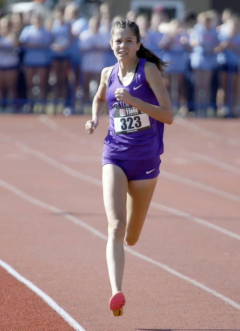 Lily Eddington of Downers Grove North runs at the Lake Park 'Harvey Braus' Invite in September 2023 in Medinah.