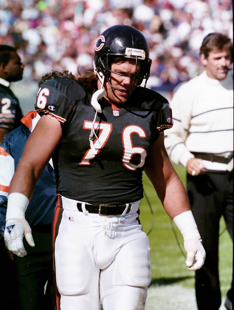 Chicago Bears defensive lineman Steve McMichael walks off of the field during a game in 1992.