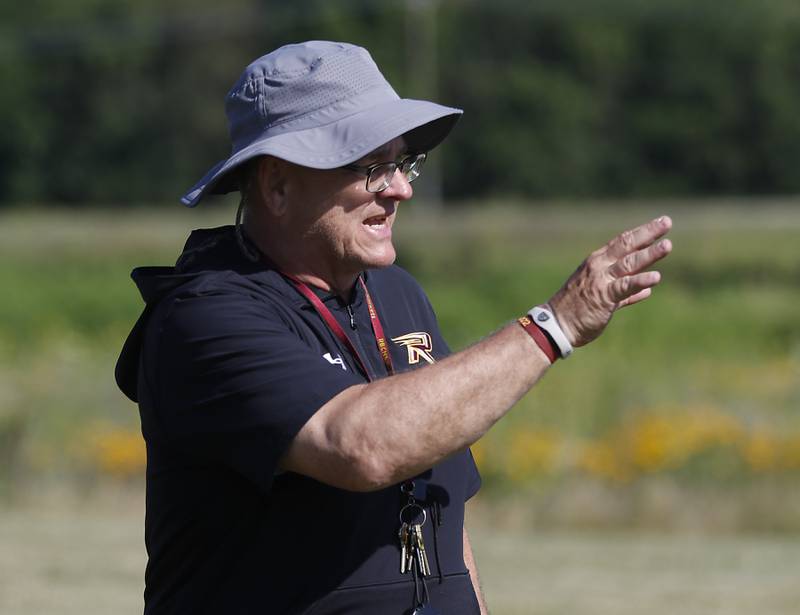 Richmond-Burton coach Mike Noll talks to his players during summer football practice Thursday, July 14, 2022, at Richmond-Burton High School in Richmond.