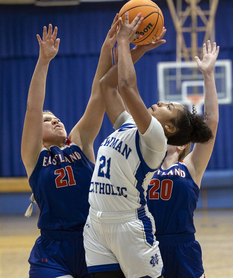 Newman’s Gisselle Martin puts up a shot against Eastland’s Olivia Klinefelter (left) and Tatum Grim Tuesday, Jan. 7, 2025, at Newman High School.