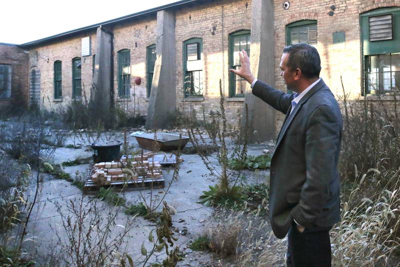 Mike Gilbert, of CM Capital Management, gives a tour of the property at 421 North California Street Monday, Nov. 13, 2023, in Sycamore. Local businessman Chris Mayer hopes to renovate the existing industrial buildings into a distillery, restaurant and event space.