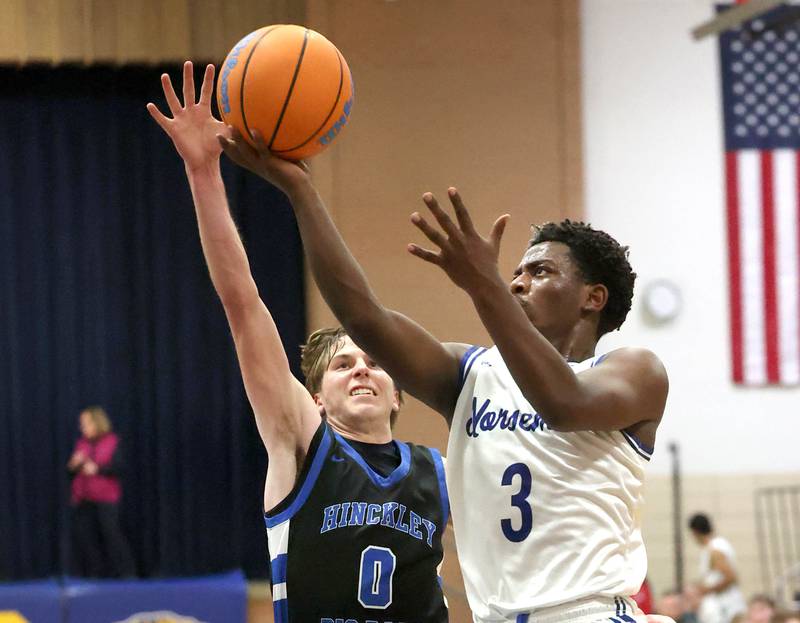 Newark's Reggie Chapman gets a layup in front of Hinckley-Big Rock's Harrison Nier Friday, Feb. 6, 2026, during their Little 10 Conference third place game at Somonauk High School.