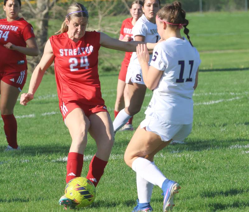 Streator's Rhea Huey kicks the ball around Serena/Newark/Earlville's Vyvienn O'Connell on Thursday, April 16, 2026 at the James Street Recreational Complex in Streator.