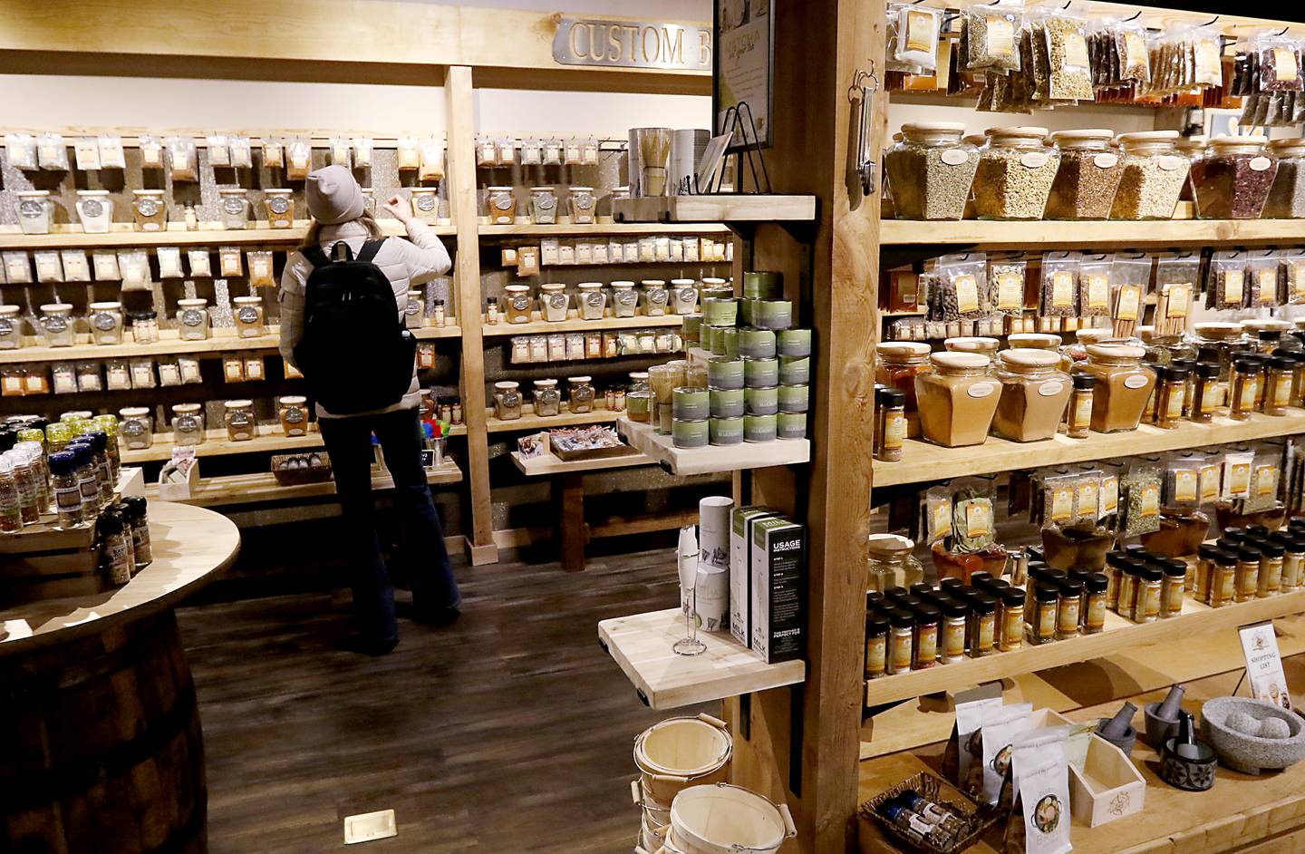A women shops on Thursday, Dec. 19, 2024, at the Spice and Tea Exchange of Crystal Lake in downtown Crystal Lake.