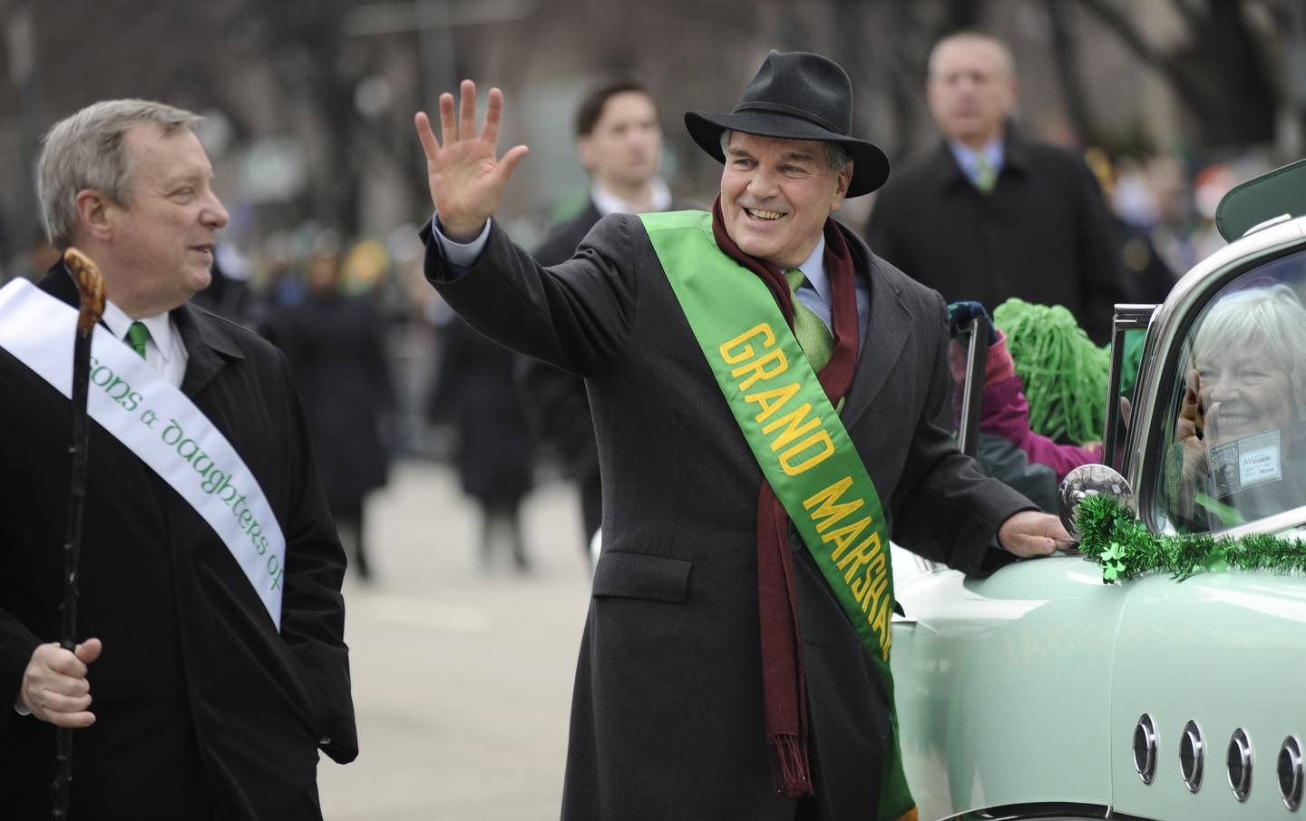 Chicago Mayor Richard M. Daley (middle) and wife Maggie (right) wave while U.S. Sen. Richard Durbin,  D-Ill., looks on during the St. Patrick's Day parade in Chicago on March 12, 2011.