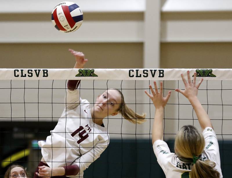 Prairie Ridge's Jada Hoyt  hit the ball away from Crystal Lake South's Joanna Kruzolek during the IHSA Class 3A Crystal Lake South Sectional final volleyball match on Thursday, Nov. 7, 2024, at Crystal Lake South High School.