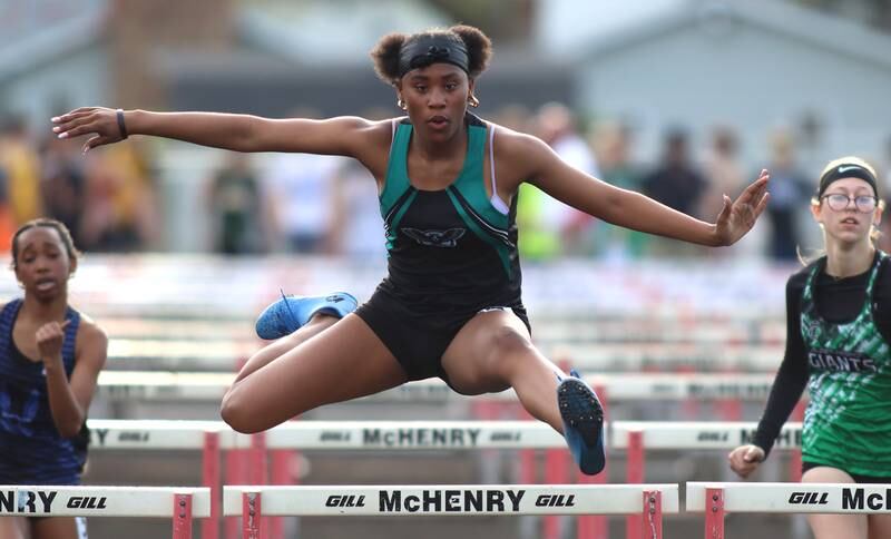 Woodstock North’s Dariya Cager competes in the 100-meter hurdles during the McHenry County Track and Field Meet at McCracken Field on Thursday, April 24, 2025, in McHenry