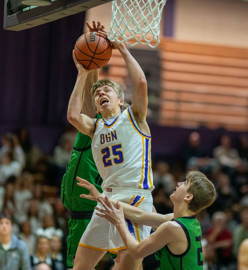 Downers Grove North's Alex Miller (25) shoots the ball in the post against York during a basketball game at Downers Grove North High School on Friday, Dec 9, 2022.