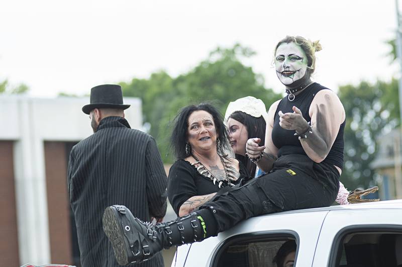 Characters from the Haunted Haven haunted barn in Rock Falls have some fun during Saturday's Fiesta Parade.