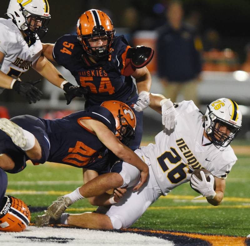 Joe Lewnard/jlewnard@dailyherald.com
Neuqua Valley’s Silvano Spatafora, right, gets tackeld by Naperville North’s Matthew Murphy during Friday’s game in Naperville.