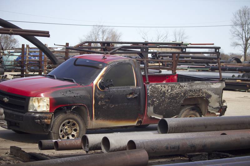 A pickup truck damaged by a fire on Monday, April 14, 2025, which destroyed a building at the site for Rovanco Piping Systems, 20535 SE Frontage Road, Joliet.