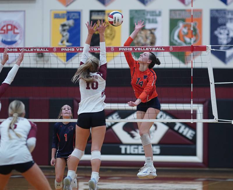 Oswego’s Mia Jurkovic (14) goes up for a kill against Plainfield North's Ella Strausberger (10) during the class 4A Plainfield North regional volleyball final at Plainfield North High School on Thursday, Oct. 26, 2023.