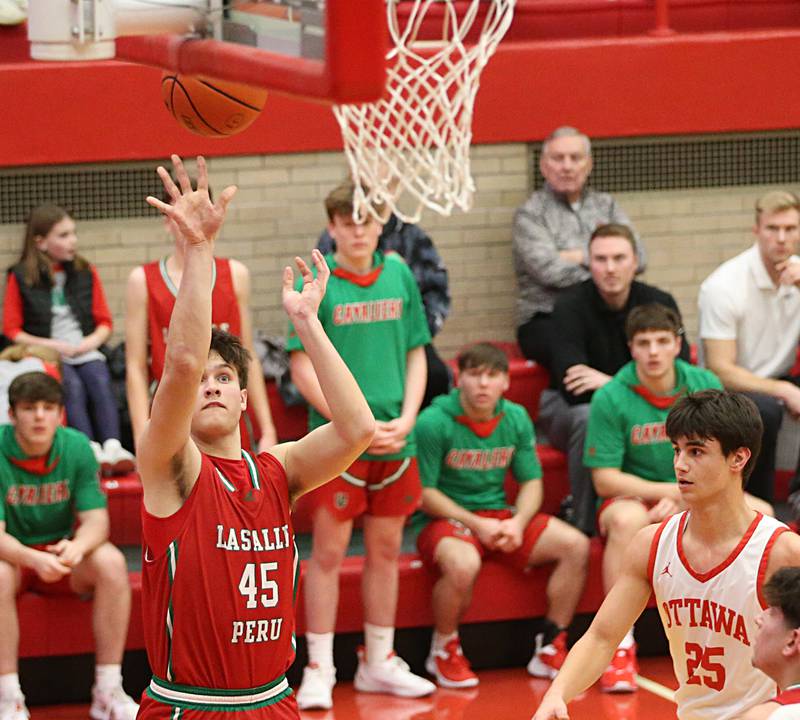L-P's Brendan Boudreau shoots a jump shot over Ottawa's Payton Knoll in Kingman Gymnasium on Friday, Feb. 10, 2023 at Ottawa High School.
