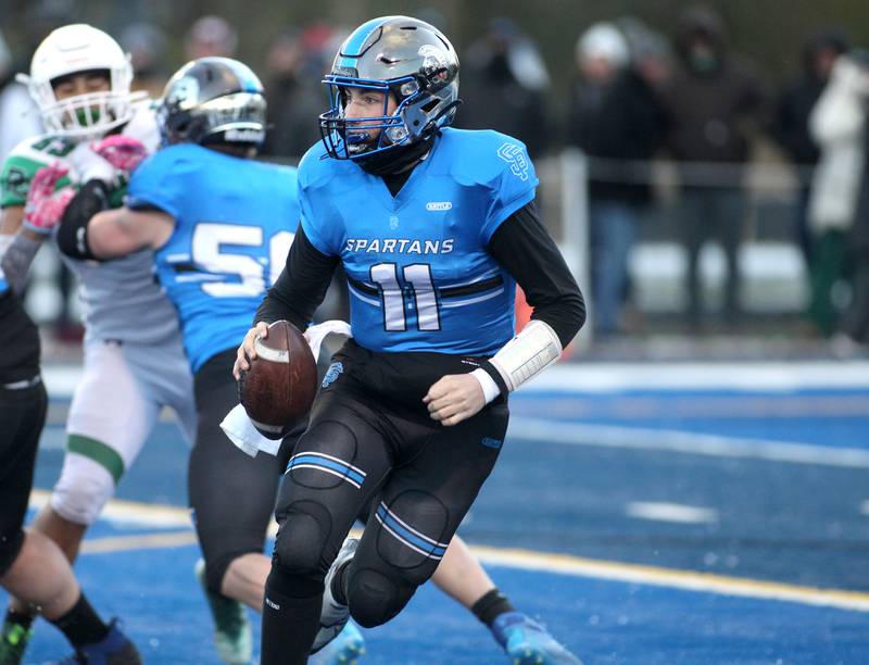 St. Francis quarterback Alessio Milivojevic (11) keeps the ball during their Class 4A semifinal game against Providence in Wheaton on Friday, Nov. 19. 2022.