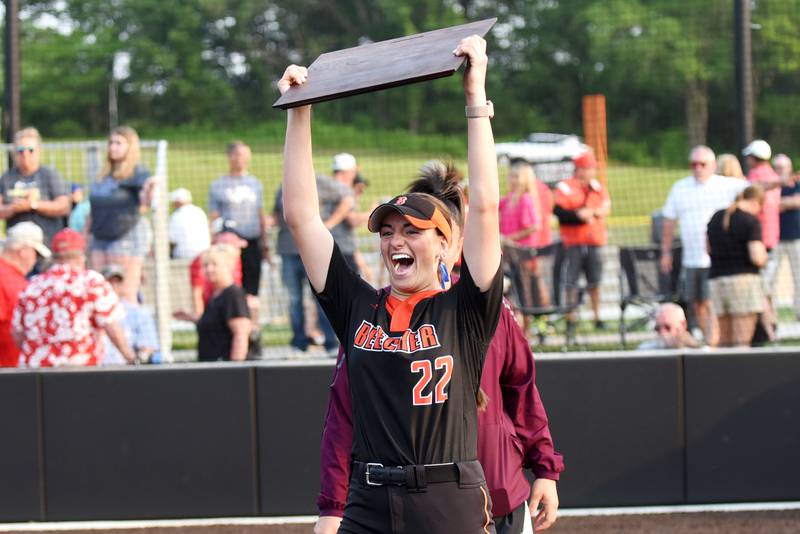 Beecher's Taylor Norkus hoists the IHSA Class 2A East Peoria Super-Sectional plaque after hitting the walk-off single in the Bobcats' 4-3 win in 10 innings over Brimfield Monday, June 2, 2025.