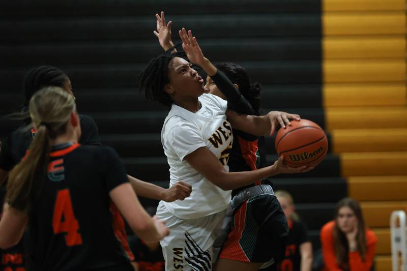 Joliet West’s Maziah Shelton battles for a shot against Plainfield East on Thursday, February 2nd.