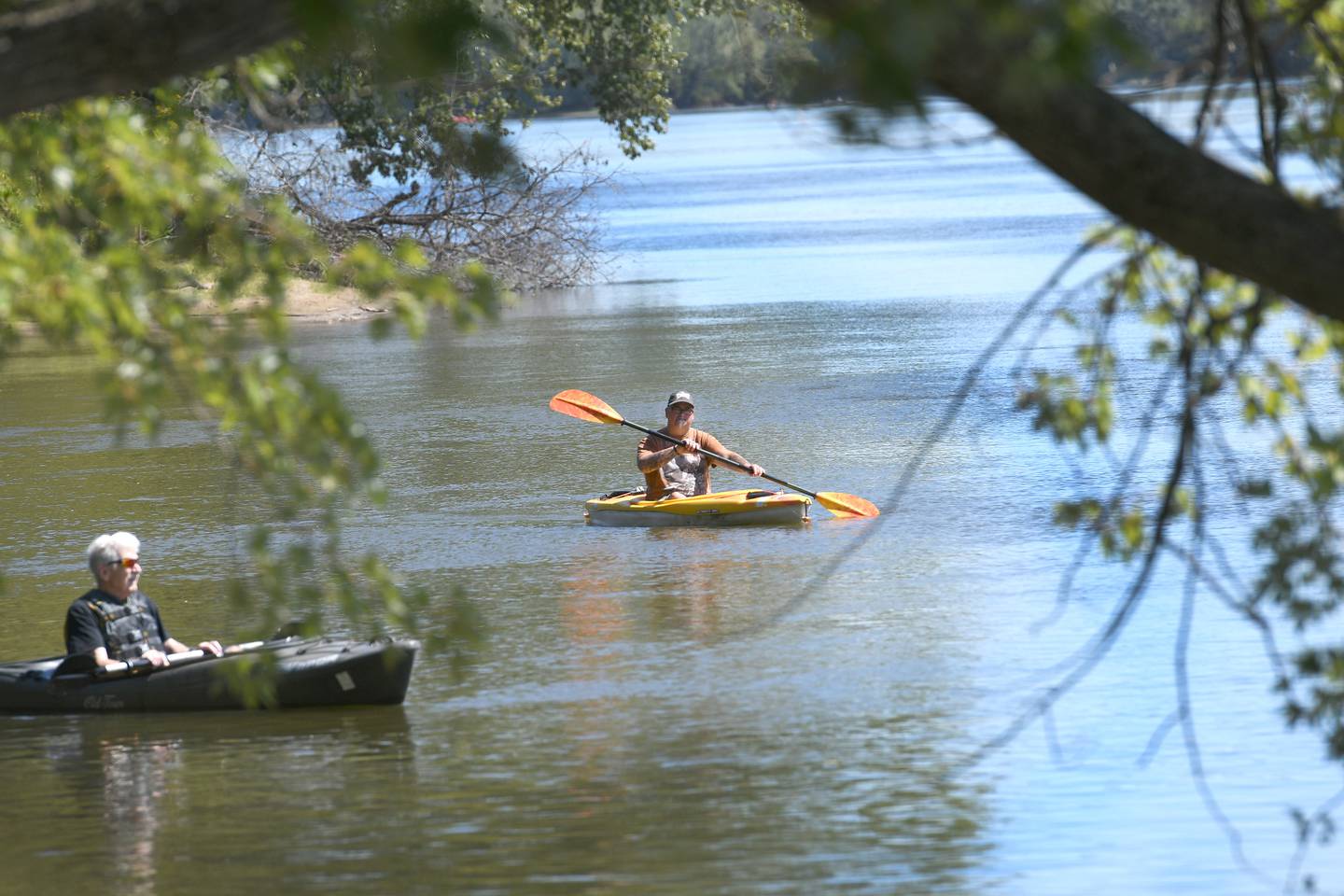Two kayakers make their way down the Rock River near Castle Rock State Park south of Oregon.