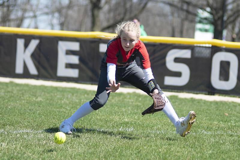 Ottawa's Grace Carroll scoops up a ball in right field against Rock Falls on Saturday, April 9, 2022.