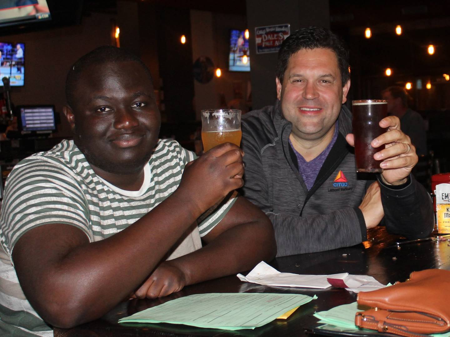 Pete Colarelli, (left) former ExxonMobil employee, mentored Brandon Adjoumani when Adjoumani was a student at Lockport Township High School. On Saturday, Adjoumani will serve in Colarelli's former role as a host for Easterseals Joliet's annual Celebration of Giving. Adjoumani blossomed through his relationship with Colarelli, which helped Adjoumani develop his own gifts and find his own path, Colarelli said.