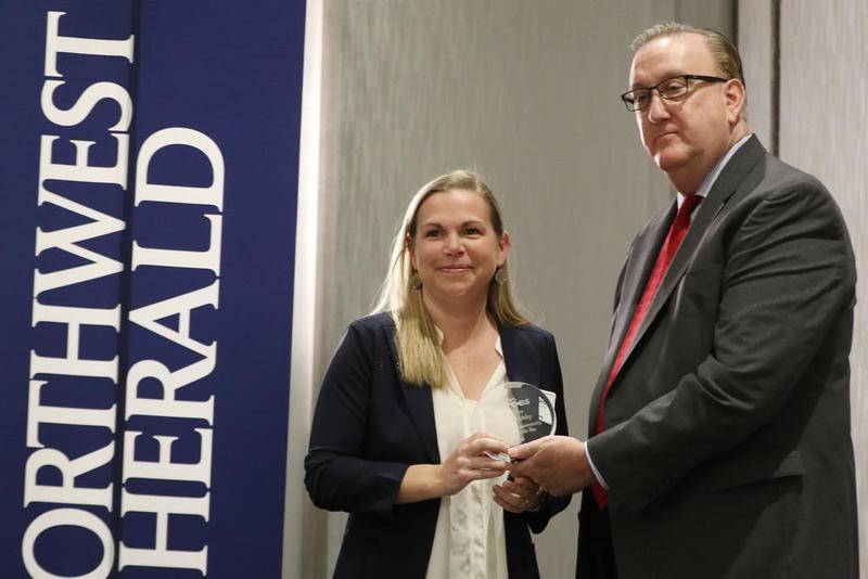 Jim Ringness presents Alicia Wehby with her award during the annual Everyday Heroes awards breakfast on Thursday, March 12, 2020 at the Holiday Inn in Crystal Lake.