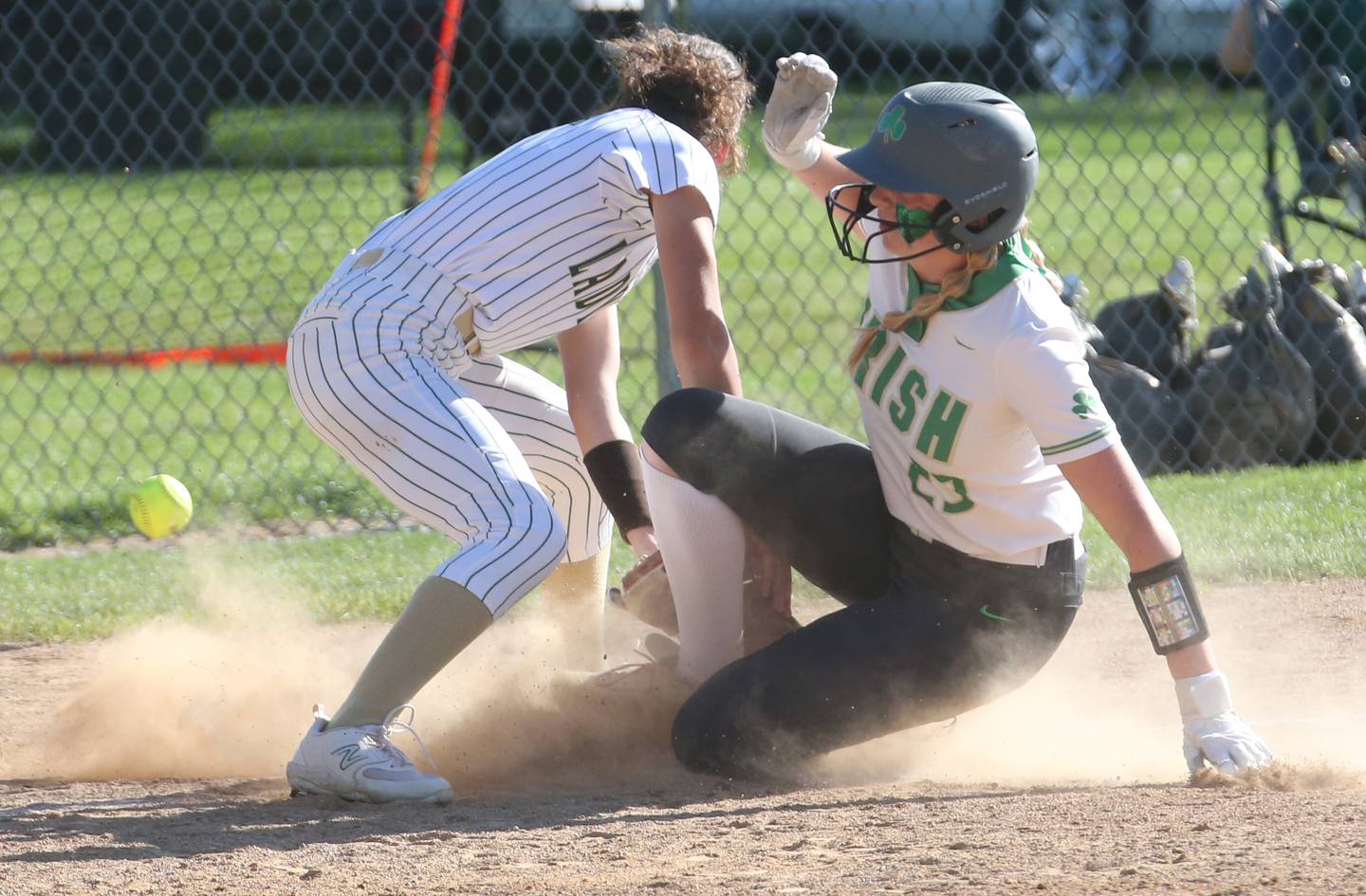 Seneca's Tessa Krull slides safely into third base as the ball gets away from St. Bede's Lili Bosnich on Tuesday, May 7, 2024 at St. Bede Academy.