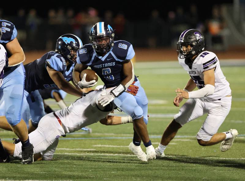Downers Grove South’s Deon Davis (6) runs against Downers Grove North during the boys varsity football game on Friday, Sept. 1, 2023.