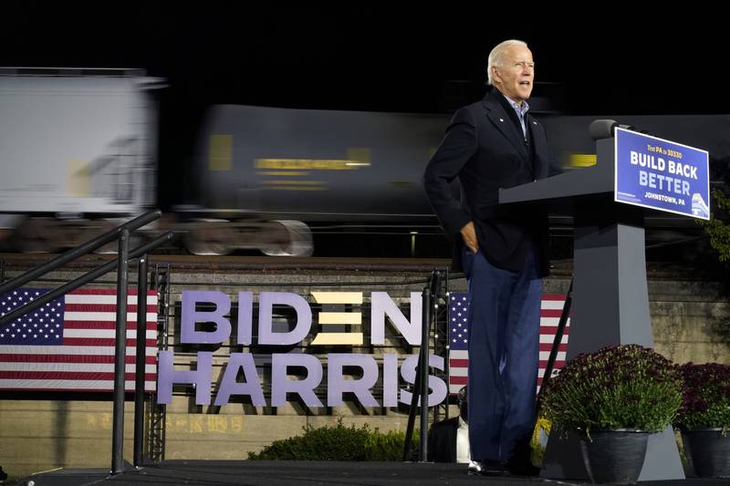 FILE - Then-Democratic presidential candidate Joe Biden speaks at the Amtrak Johnstown Train Station, Sept. 30, 2020, in Johnstown, Pa. President Joe Biden believes that unions built the middle class. He also knows a rail worker strike could damage the economy ahead of midterm elections. That leaves him in the awkward position of espousing the virtues of unionization even as members of his administration work to keep talks going in Washington between the railroads and unionized workers aimed at averting a shutdown. (AP Photo/Andrew Harnik, File)