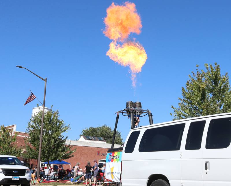 A burst of propane is released from a hot air balloon gondola basket during the 52nd annual Homestead Festival parade on Saturday, Sept. 9, 2023 in Princeton.