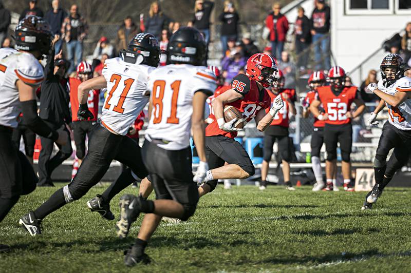Amboy’s Brennan Blaine gets big yards up the middle on his way to a TD against FCW Saturday, Nov. 4, 2023 in the 8-man semifinal game in Amboy.