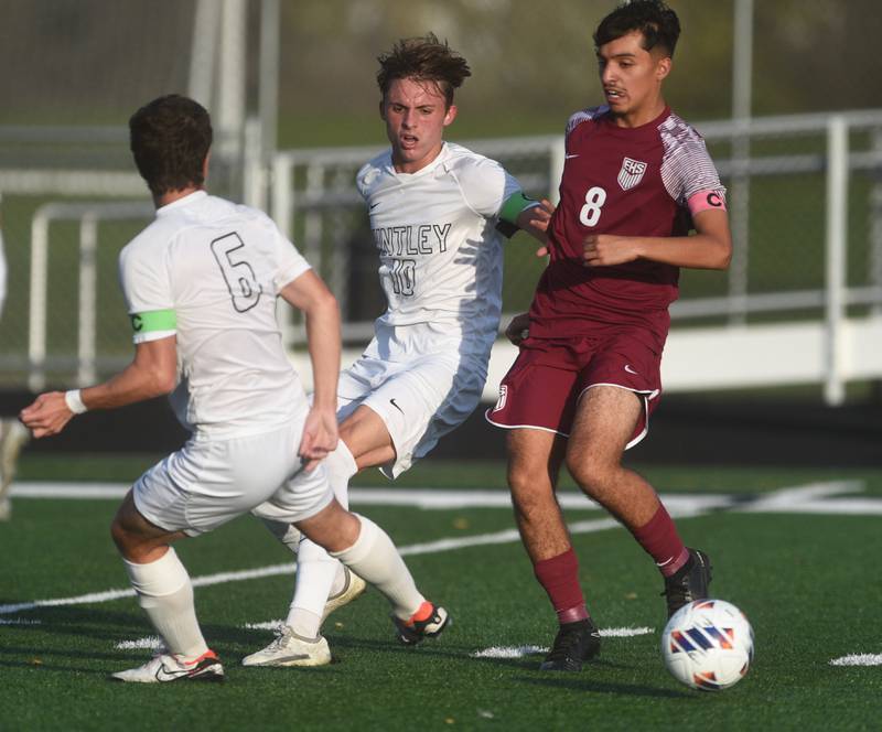 Huntley's Hudson Nielsen (10) works for ball control with Elgin's Aaron Saldana (8) during Tuesday’s IHSA class 3A sectional semifinal boys soccer game in Round Lake.  Nielsen scored Huntley's only goal of the game.