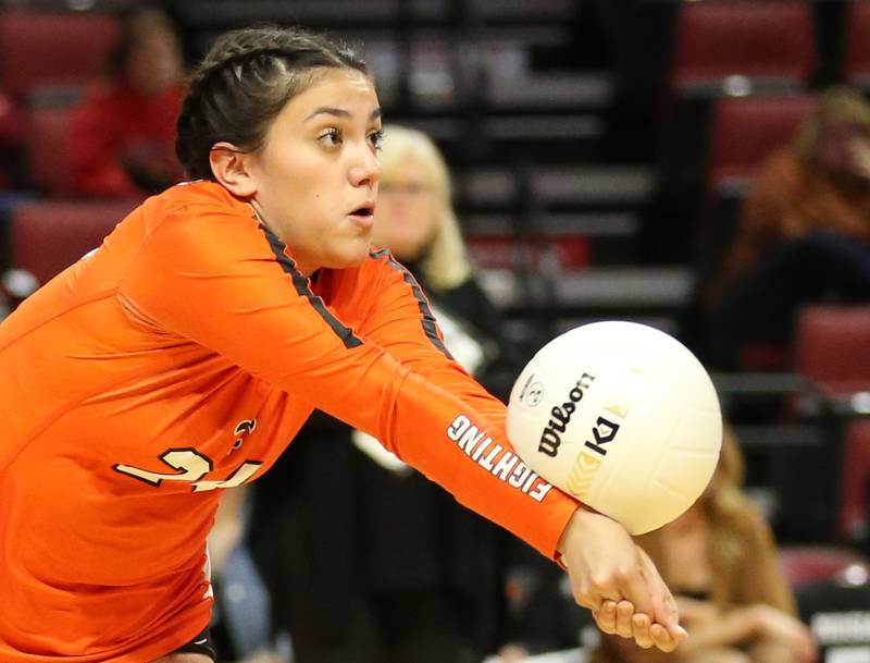 St. Charles East's Maya Lopez returns a serve from Mother McAuley in the Class 4A semifinal game on Friday, Nov. 11, 2022 at Redbird Arena in Normal.