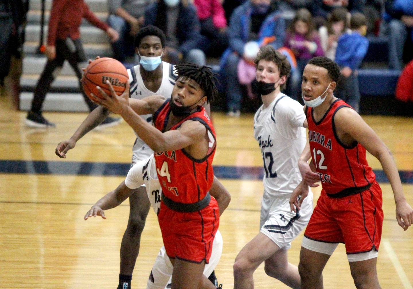 West Aurora’s Terrence Smith grabs a rebound during a game at Oswego East on Friday, Jan. 28, 2022.