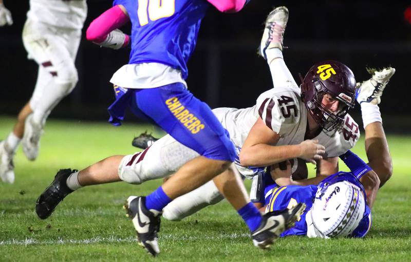 Richmond-Burton’s Riley Shea lunges for yards as he concludes a run in IHSA football Class 3A second-round playoff action at Bob Stewart Field on the campus of Aurora Central Catholic High School in Aurora on Friday, November 7, 2025.