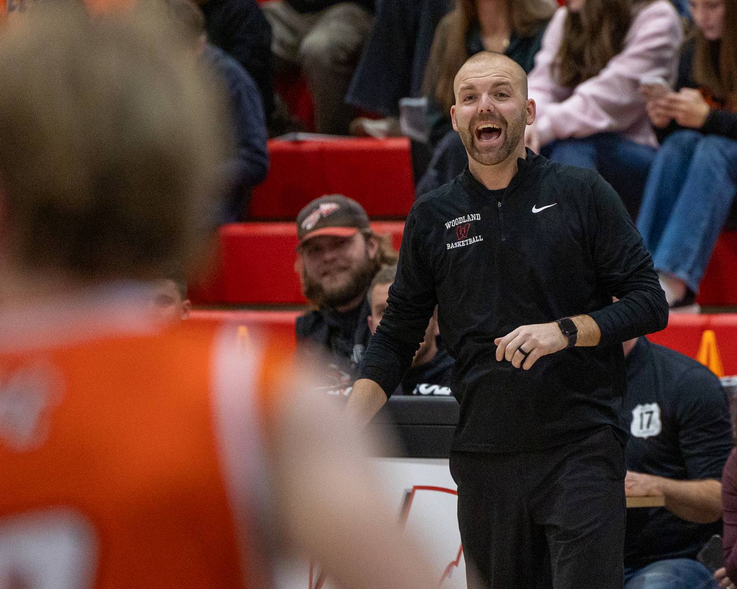 Woodland boys basketball coach Connor Kaminke yells from the sideline Wednesday, Nov. 26, 2025, at Woodland School in rural Streator.