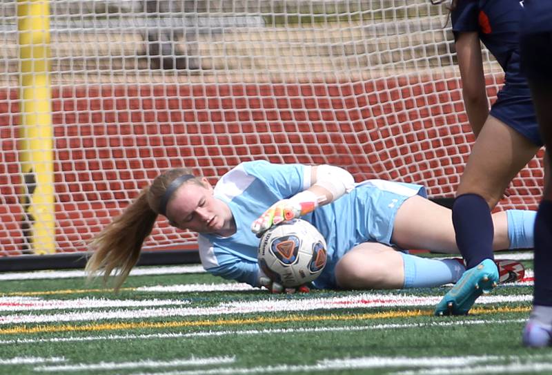 Geneva goalkeeper Jordan Forbes makes a save during a Naperville Invitational game against Oswego at Naperville Central on Saturday, April 23, 2022.