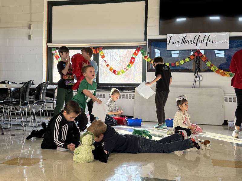 Nettle Creek Elementary students work on coloring sheets with their stuffed animals on Wednesday, Nov. 11, 2025.