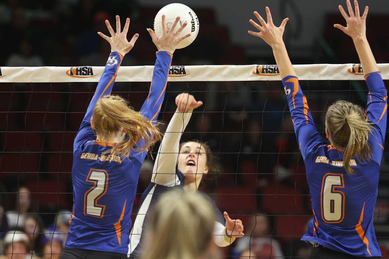 IC Catholic’s Cassie Levy hits a shot against Genoa-Kingston in the Class 2A championship match on Saturday in Normal.