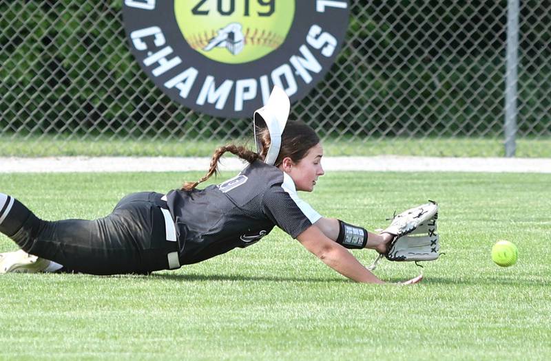 Kaneland's Olivia Stoker makes a diving attempt to catch a ball during their Class 3A Regional game against Woodstock Tuesday, May 24, 2022, at Kaneland High School in Maple Park.