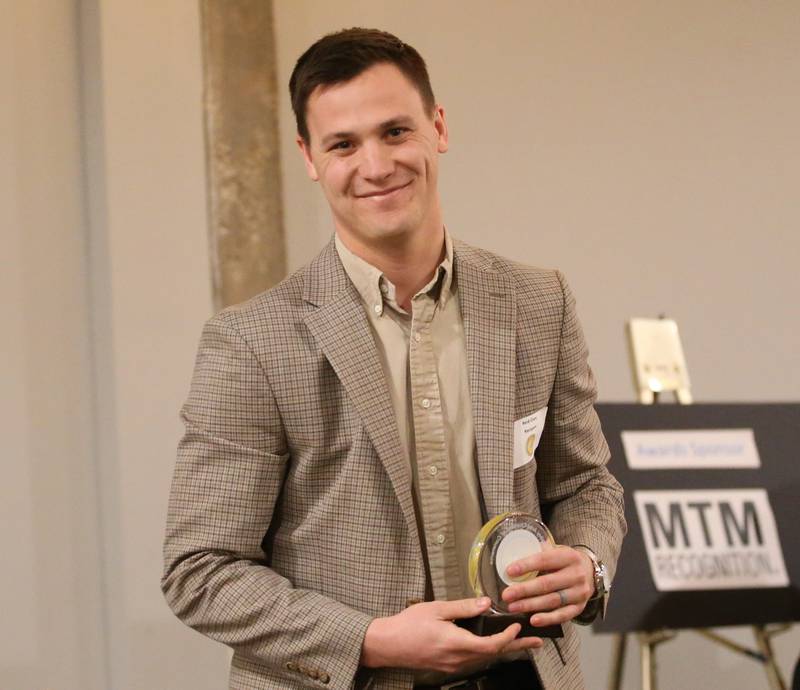 Reid Clary, Vice President, AssuredPartners Agribusiness, poses with his award during the Illinois Valley Chamber of Commerce 40 Under Forty Awards Gala on Thursday, Feb. 9, 2023 at Westclox in Peru.